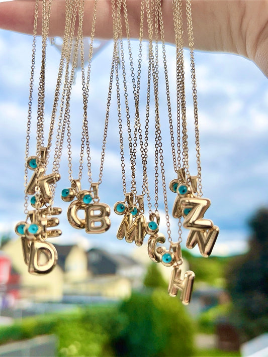 Buchstabenkette Nazar 14K vergoldet